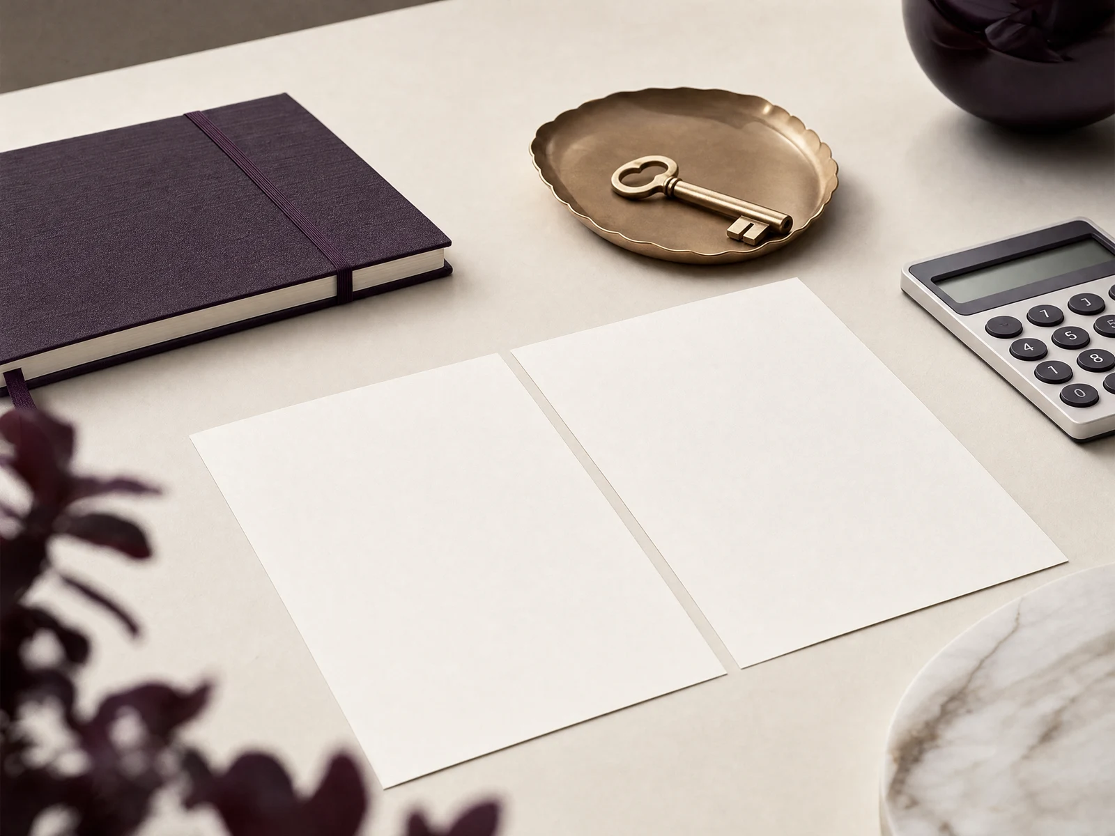 Illustrative desk with an open comparison notebook, calculator and key